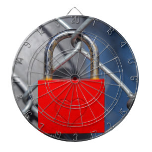 Red heart lock on fence dartboard with darts