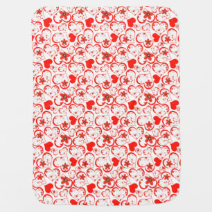 Red hearts and flowers on a white baby blanket