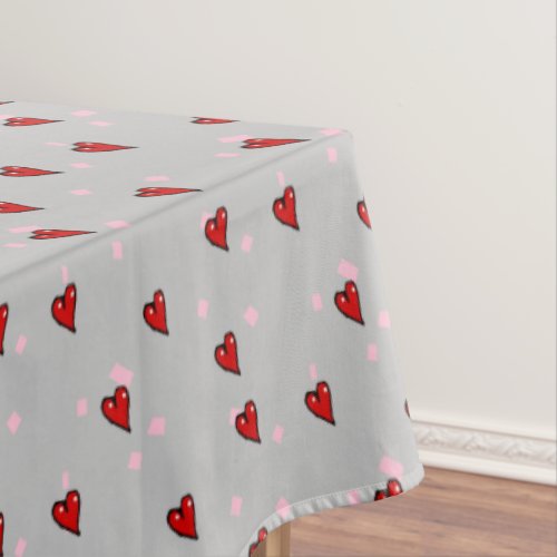 Red hearts on grey tablecloth