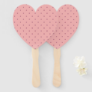 Red hearts on pink hand fan