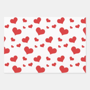 Red hearts on wrapping paper sheets