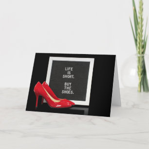 red high heel shoes with quote card