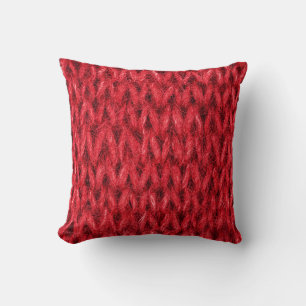 Red knitting wool texture background. throw pillow