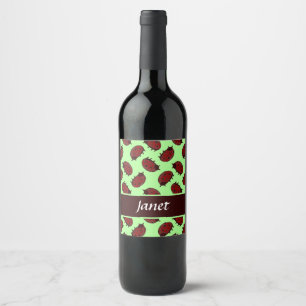 Red ladybugs on green wine label