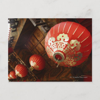 red lanterns hanging from temple roof postcard