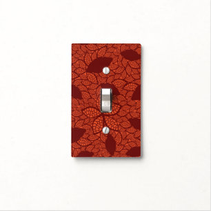 Red leaves pattern on orange light switch cover