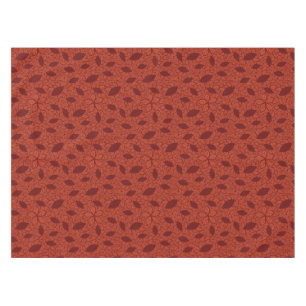Red leaves pattern on orange tablecloth