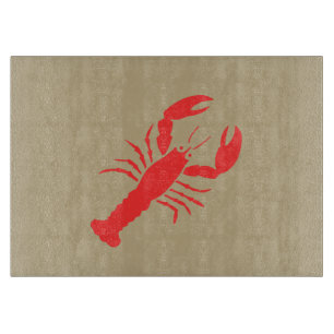 red lobster on khaki cutting board