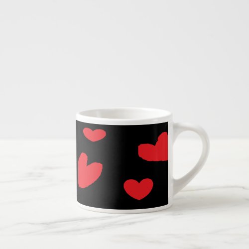 Red love hearts on black espresso cup