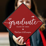 Red Modern Chic Elegant White Script Hearts Graduation Cap Topper<br><div class="desc">Your favorite grad will stand out and make a statement when they wear this graduation cap topper! Let them celebrate their milestone with this girly, stunning, simple, modern, custom graduation keepsake. A fun, playful visual of white script handwriting and cute, playful hearts, along with her name and class year, overlay...</div>