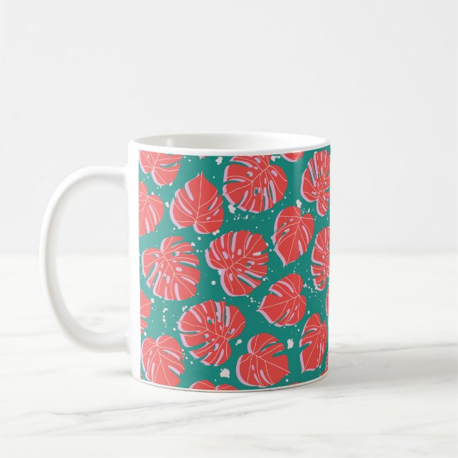 Red monstera leaves on green seamless pattern. Tre Coffee Mug (Left)