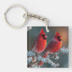 Red Northern Cardinals Perched on a Frosted Branch Keychain