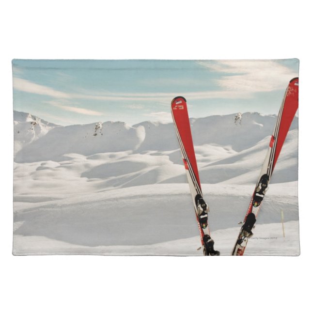 Red pair of ski standing in snow cloth placemat (Front)