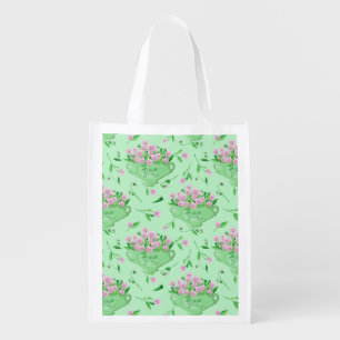 Red pansies green bowl and background grocery bag
