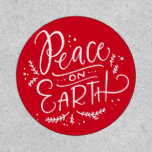 Red Peace on Earth Typography Holiday Patch<br><div class="desc">Peace on Earth. Send holiday wishes with this festive and simple holiday patches. It features modern calligraphy with foliage and snow accents on a red background. Perfect for the holiday season.</div>
