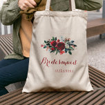 Red peony bouquet winter wedding bridesmaid tote bag<br><div class="desc">Rustic elegant floral wedding stylish bridesmaid / maid of honor / flower girl tote bag featuring a watercolor red burgundy and white peonies winter bouquet with seasonal pine green bir branches, red berries and foliage and whit your custom text. Fill in your information in the spots, You can choose to...</div>