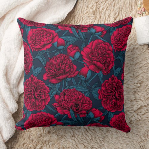 Red peony garden on dark blue throw pillow