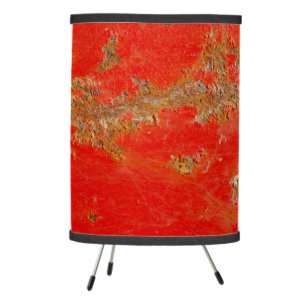 Red personalized antique car, rusted metal tripod lamp