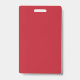 Red, pink, and orange garments hang side by side o badge