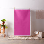 Red, pink, and purple paint strokes overlap and bl fabric