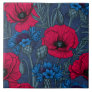 Red poppies and blue cornflowers on blue ceramic tile