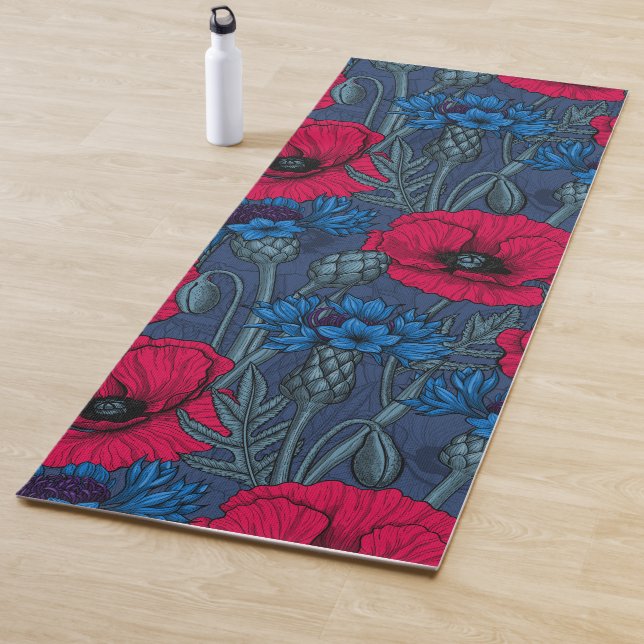 Red poppies and blue cornflowers on blue yoga mat (In Situ)