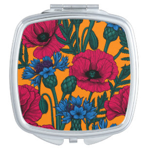 Red poppies and blue cornflowers on orange compact mirror