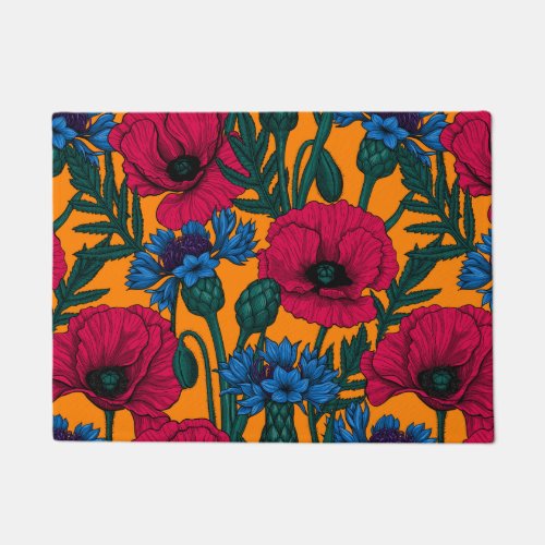 Red poppies and blue cornflowers on orange doormat