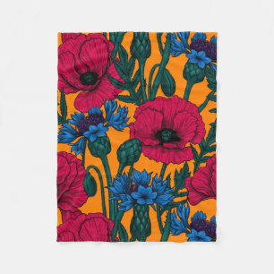 Red poppies and blue cornflowers on orange fleece blanket