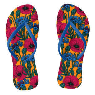 Red poppies and blue cornflowers on orange flip flops