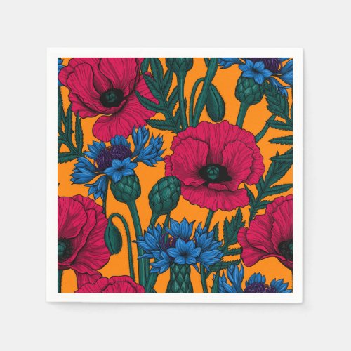 Red poppies and blue cornflowers on orange napkins