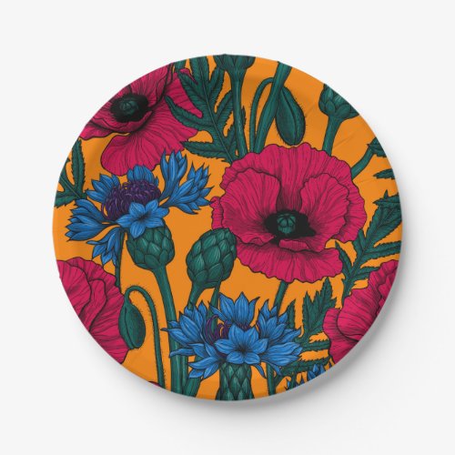 Red poppies and blue cornflowers on orange paper plates