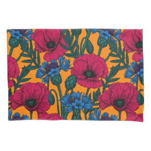 Red poppies and blue cornflowers on orange pillow case