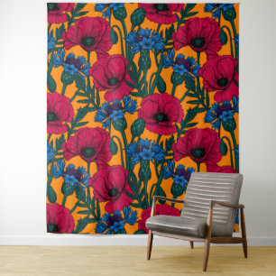 Red poppies and blue cornflowers on orange tapestry