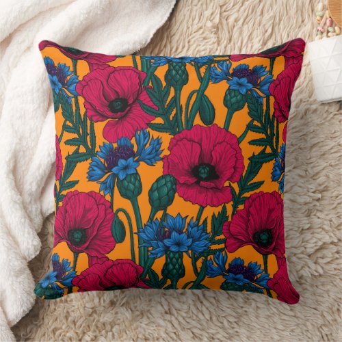 Red poppies and blue cornflowers on orange throw pillow