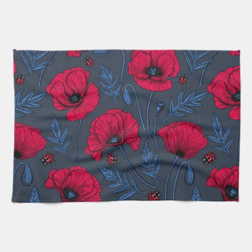 Red poppies and ladybugs on dark blue kitchen towel