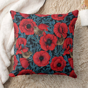 Red poppies and wrens, blue leaves on black throw pillow