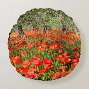 Red poppy flowers under old olive trees round pillow