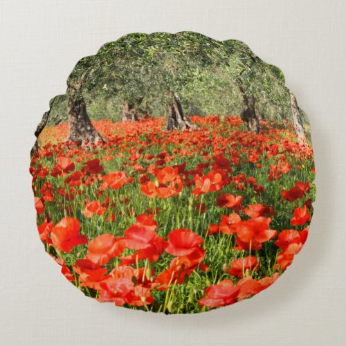 Red poppy flowers under old olive trees round pillow