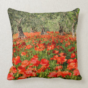 Red poppy flowers under old olive trees throw pillow