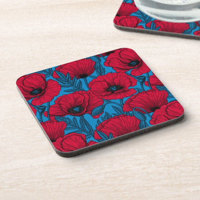 Red poppy garden on blue beverage coaster (Left Side)