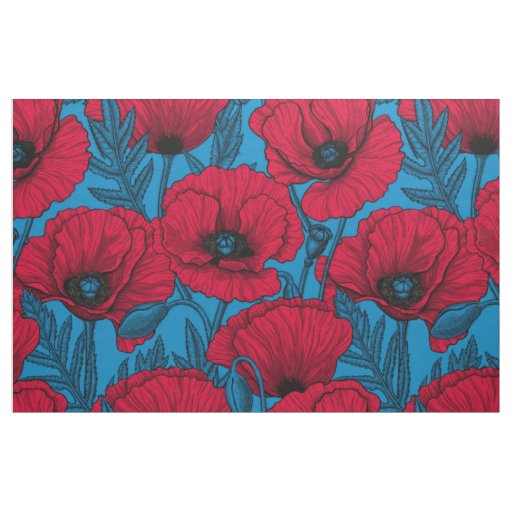 Red poppy garden on blue fabric