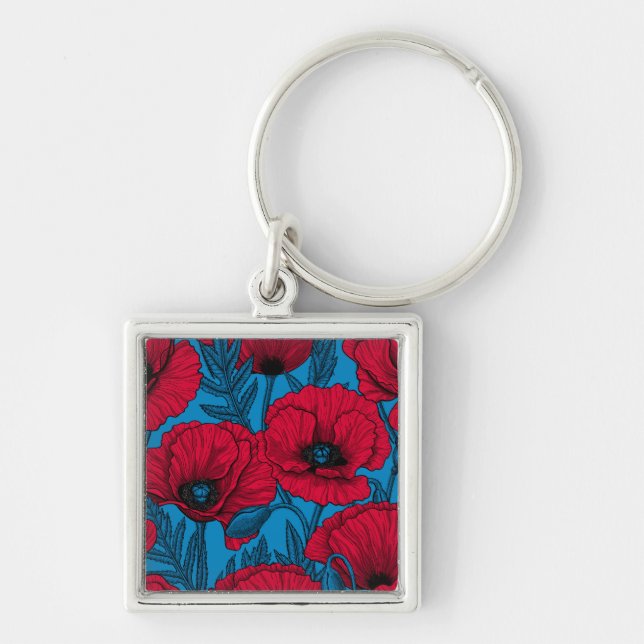 Red poppy garden on blue keychain (Front)