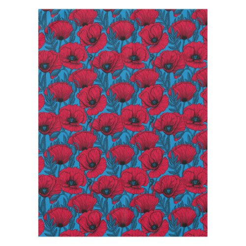 Red poppy garden on blue tablecloth