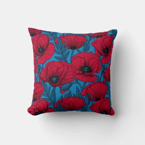 Red poppy garden on blue throw pillow