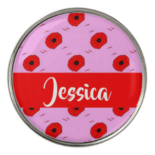 Red poppy on pink golf ball marker