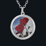 Red Roses Against a Bright Blue Sky Silver Plated Necklace<br><div class="desc">Red Roses Against a Bright Blue Sky Photo by Sandy Closs,  taken at Lake Arrowhead. "red rose""red roses""pink rose""pink roses""weddings""love gift""red flower""red flowers""red floral" red blue rose roses "gifts with roses"</div>