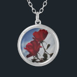 Red Roses Against a Bright Blue Sky Silver Plated Necklace<br><div class="desc">Red Roses Against a Bright Blue Sky Photo by Sandy Closs,  taken at Lake Arrowhead. "red rose""red roses""pink rose""pink roses""weddings""love gift""red flower""red flowers""red floral" red blue rose roses "gifts with roses"</div>