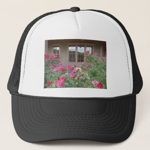 Red Roses and a reflection of the Mts in windows Trucker Hat