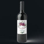 Red Roses Christmas Bouquet Personalized Wine Label<br><div class="desc">This pretty Christmas wine label is a pretty way to package that gift of Holiday wine! Each one features a beautiful watercolor half wreath of red roses, red berries and greenery at the top. Below the image is the text "Merry Christmas" in dark violet red, and your custom text in...</div>